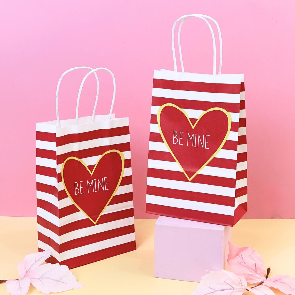 White twisted paper bag Red heart print, horizontal stripes, 14x7X21.50 cm.