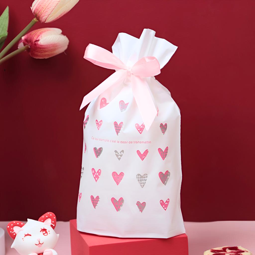 ถุงของขวัญ พร้อมโบว์ ลายหัวใจสีชมพู 02  ขนาด 15x6x23 ซม.